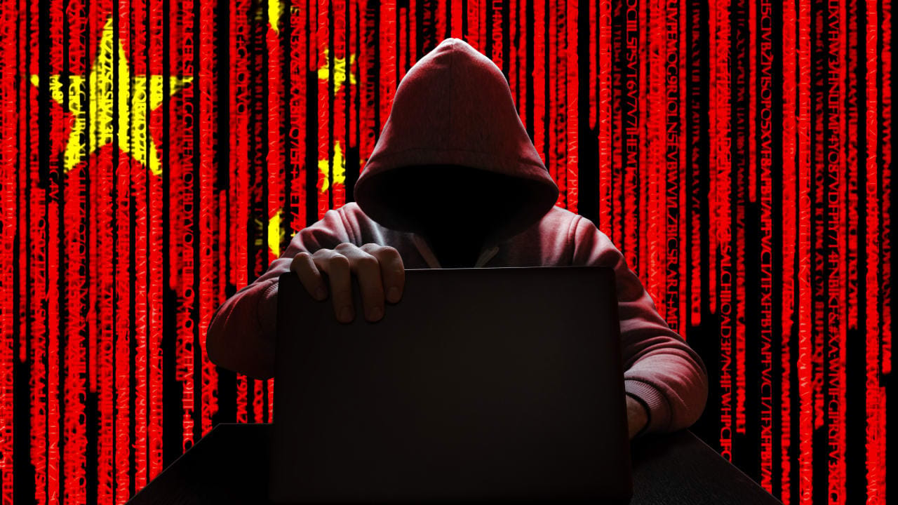 Illustrative image of a hacker with a China flag.