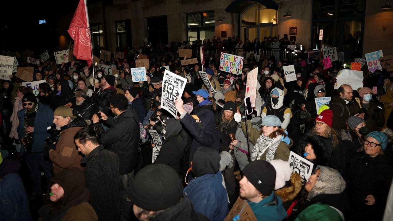 People attend a demonstration against increased immigration enforcement, days after the fatal shooting of Renee Nicole Good by a US Immigration and Customs Enforcement (ICE) agent, outside a hotel that demonstrators believe is being used by federal agents, in Minneapolis, Minnesota, US, January 9, 2