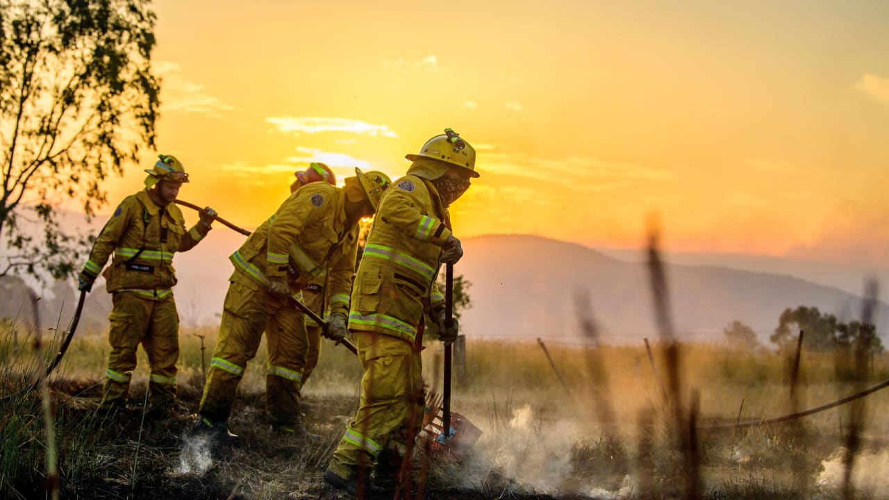 CFA firefighters conduct black-out operations at dusk as they mop up remaining hot spots following bushfire activity near Alexandra, Victoria, Australia, as extreme fire danger conditions persist across the state, January 10, 2026.