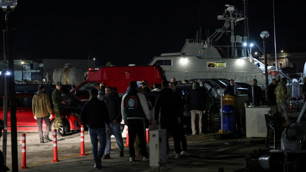 Greek emergency personnel wait to transfer bodies of dead migrants, following migrant’s boat collision with coast guard off the island of Chios, in the port of Chios, Greece, February 3, 2026. 