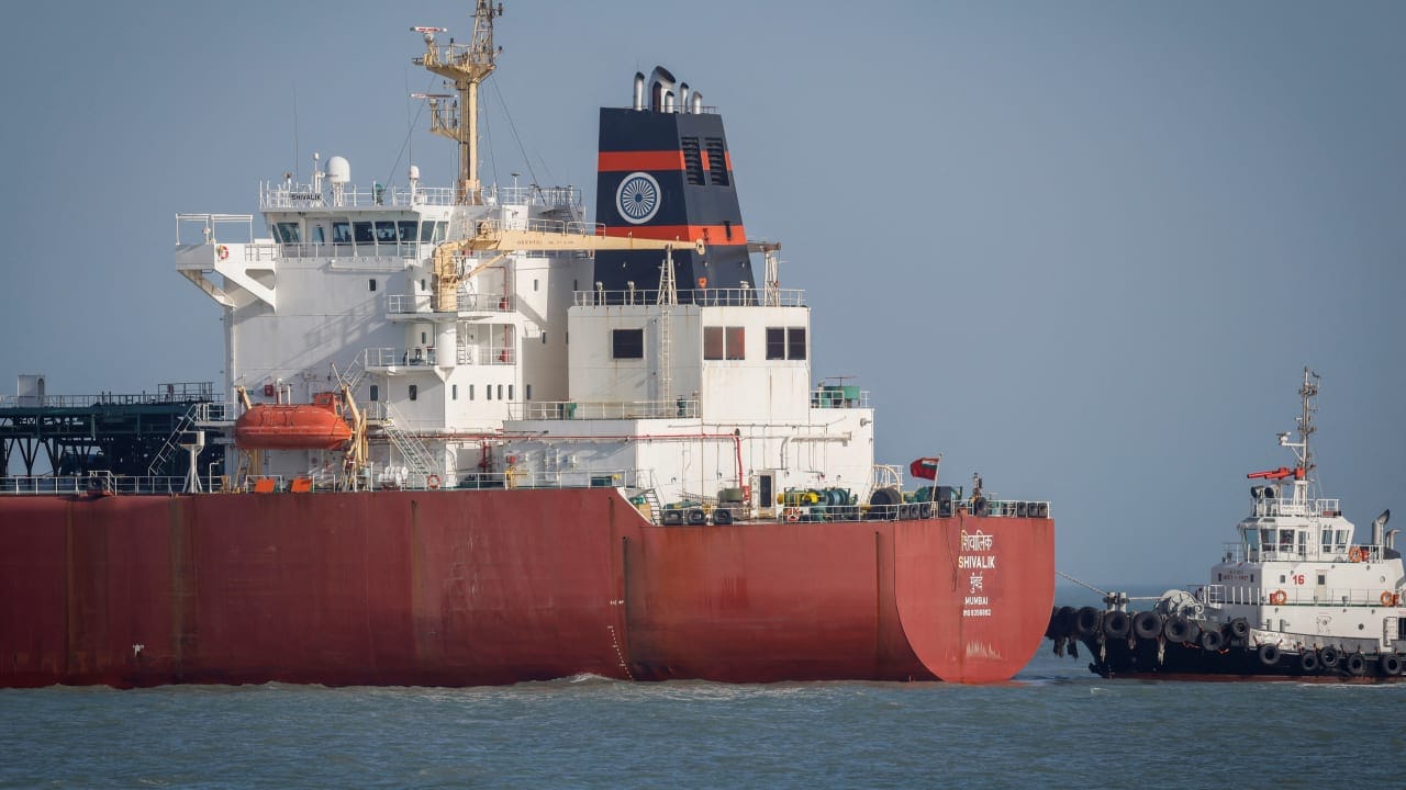 A coastguard boat approaches an Indian liquefied petroleum gas (LPG) carrier, Shivalik, as it arrives at Mundra Port via the Strait of Hormuz, amid the US-Israel conflict with Iran, in Gujarat, India, March 16, 2026. 