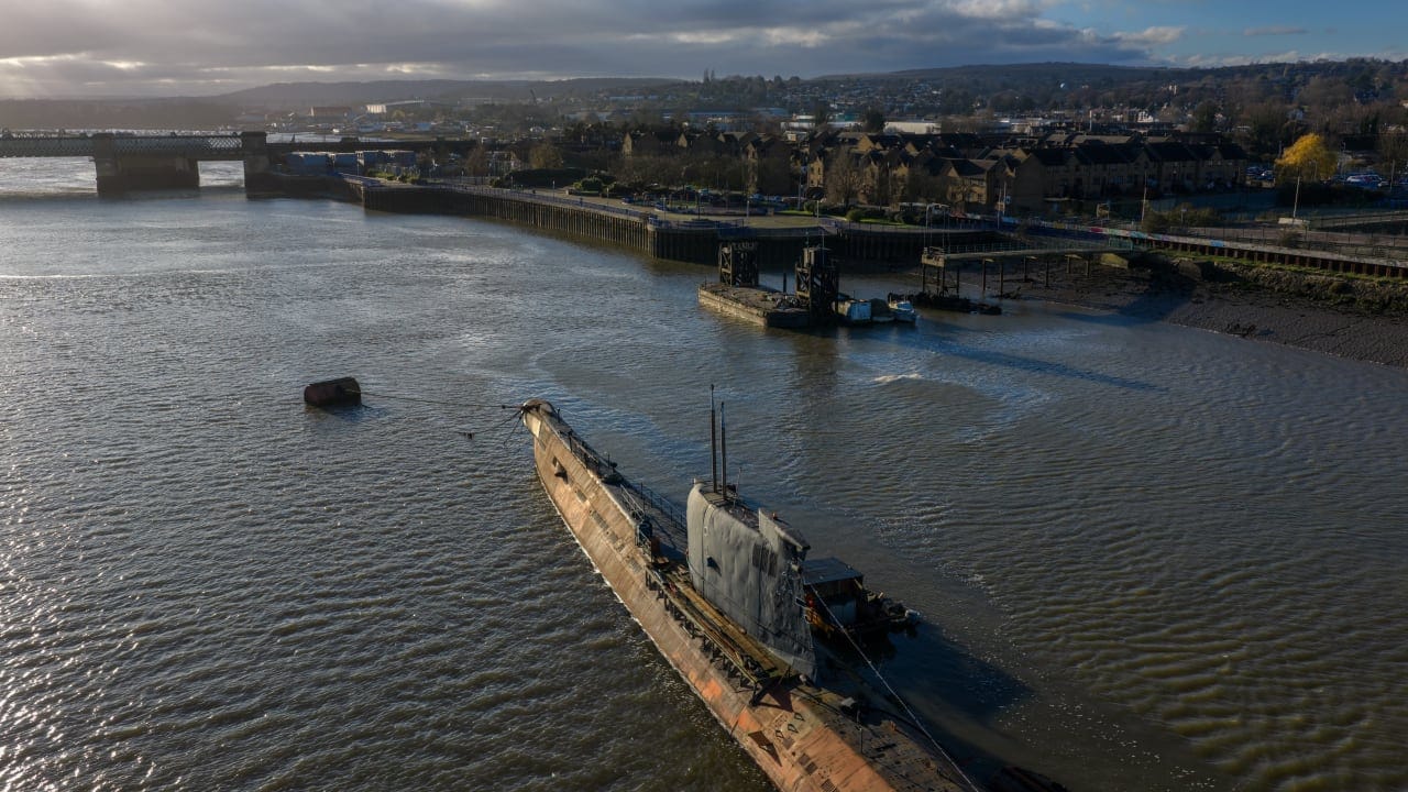  In this aerial view, the U-475 Black Widow, a former Soviet Navy submarine, lies moored in the River Medway on December 11, 2025 in Strood, England. 