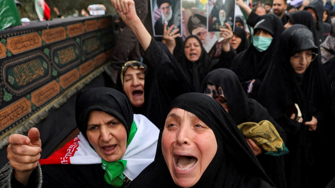 DECLARING A  post-Islamist era is premature: Attendees at the funeral of Iranian intelligence minister Esmail Khatib at Tehran’s Grand Mosque, March 20.