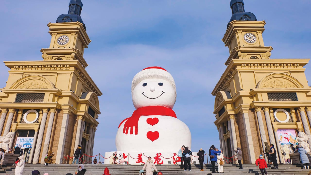 CHINA’S ‘ICE CITY’: The giant snowman at Harbin Musical Park, a city landmark. Tourists enjoy Harbin’s Ice and Snow World (L) and the International Ice and Snow Sculpture Festival. 
