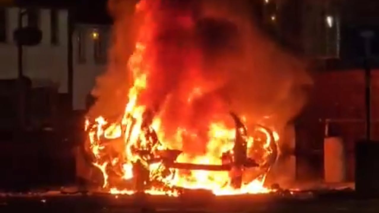 Burning car outside of a police station in Belfast, North Ireland, April 26, 2026.