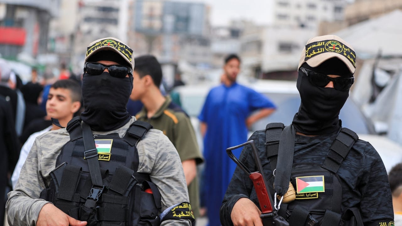 Terrorists from Palestinian Islamic Jihad stand on a street during Eid al-Adha, in Gaza City, May 27, 2026.