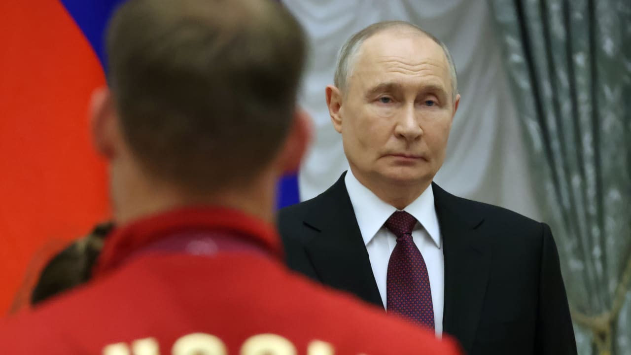 Russian President Vladimir Putin listens to the national anhem during an awards ceremony at the Kremlin, on March 19, 2026 in Moscow, Russia. Vladimir Putin receives national paralympic team who participaned in Milano Cortina 2026 Winter Paralympic Games. 