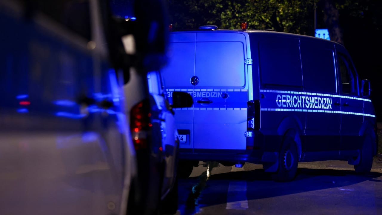 Forensic pathologist van at an allotment garden complex in the Berlin suburb of Spandau after a known Islamist, suspected of ramming a minivan into a crowd near Berlin's annual Christopher Street Day Pride parade on Saturday evening, was shot and killed in a police operation, in Berlin, Germany