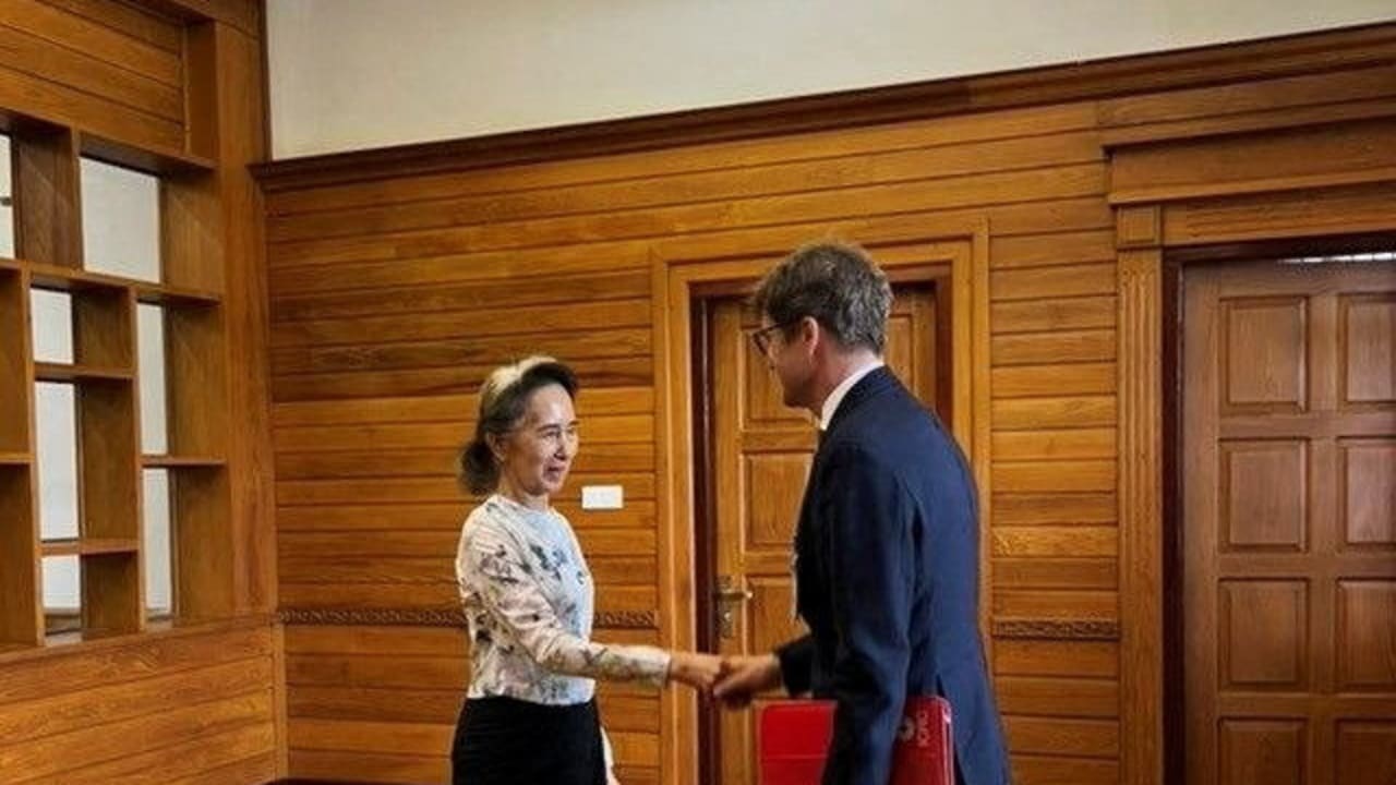Myanmar's detained former leader Aung San Suu Kyi shakes hands with Myanmar's Resident Representative and Head of Delegation for the International Committee of the Red Cross (ICRC) Arnaude de Baecque, in Naypyidaw, Myanmar August 3, 2026.
