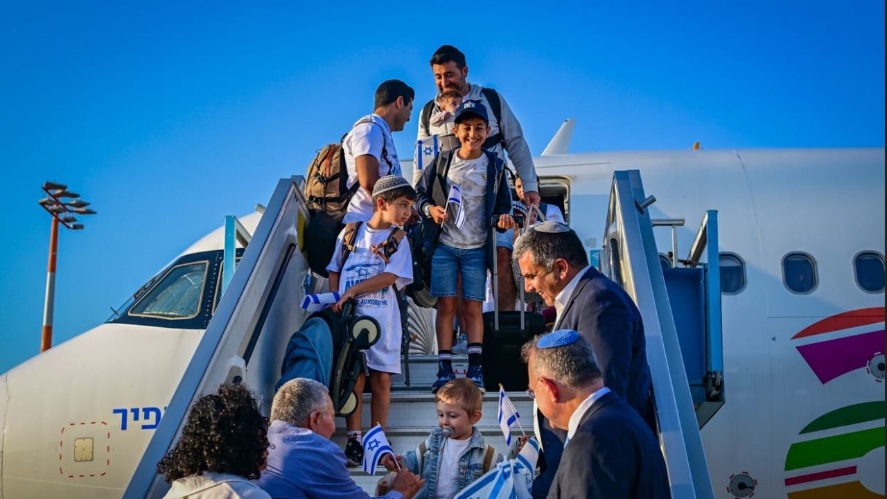 Immigrants from France are welcomed to Israel at Ben-Gurion Airport in August.