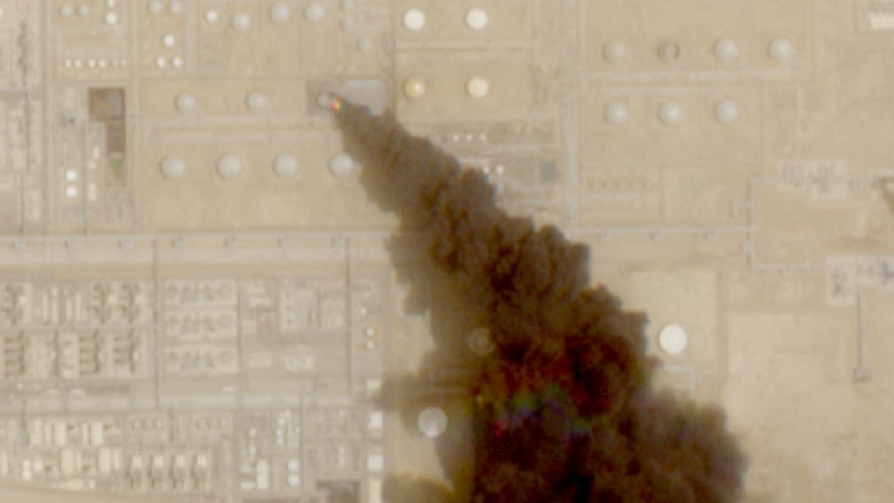 A satellite image shows trail of smoke rising from an oil facility, in Jizan, Jazan province, Saudi Arabia, July 26, 2026.