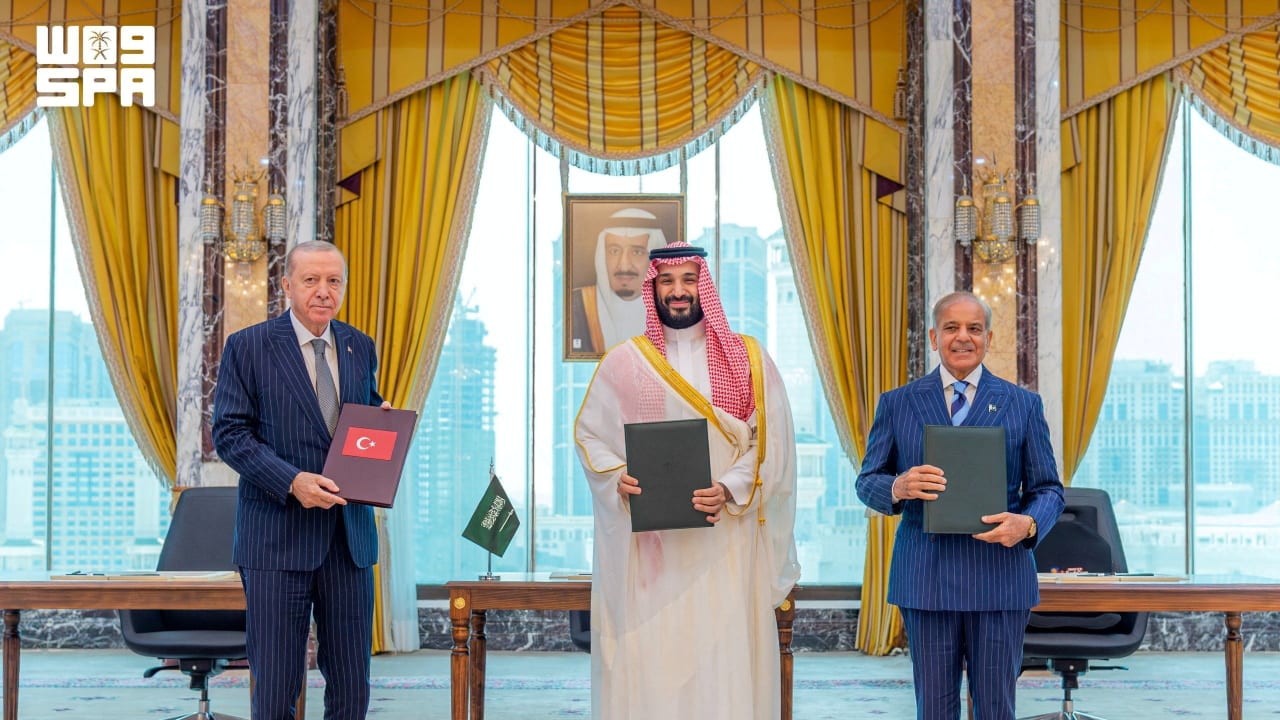 Turkish President Tayyip Erdogan, Saudi Crown Prince Mohammed bin Salman, and Pakistan's Prime Minister Shehbaz Sharif pose after signing a joint defence agreement in Mecca, Saudi Arabia, August 7, 2026.