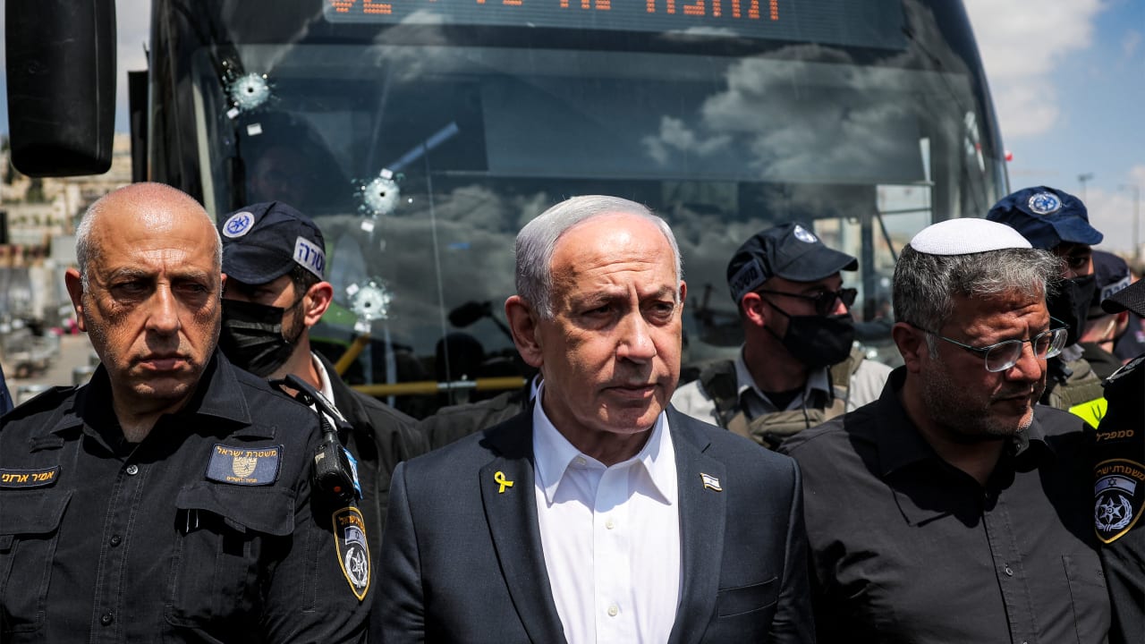 Israel’s Prime Minister Benjamin Netanyahu (C) and National Security Minister Itamar Ben-Gvir (R) visit the scene of a shooting at the Ramot road junction in Israeli-annexed east Jerusalem on September 8, 2025. 