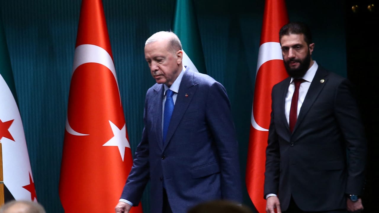 Syria's Ahmed al-Sharaa and Turkey's President Tayyip Erdogan arrive for a joint press conference at the Presidential Palace in Ankara, Turkey, February 4, 2025
