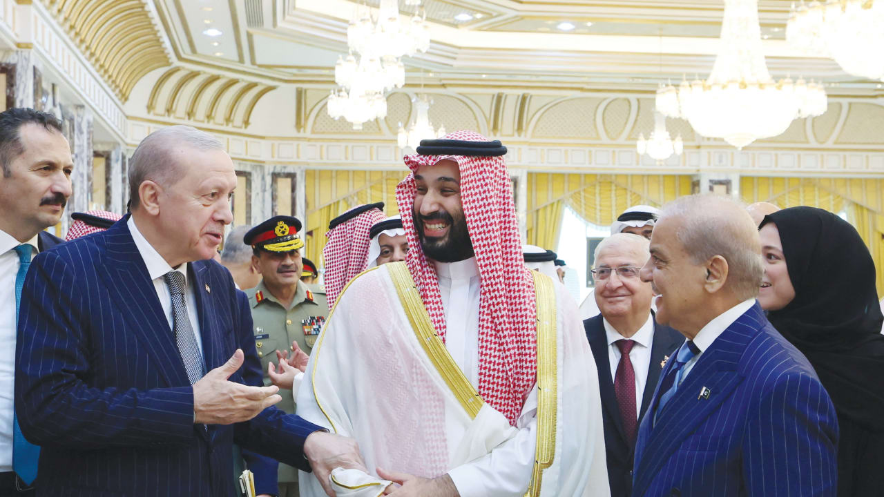 (From L) TURKISH PRESIDENT Recep Tayyip Erdogan, Saudi Crown Prince Mohammed bin Salman, and Pakistan’s Prime Minister Shehbaz Sharif chat after signing a joint defense agreement in Mecca, Saudi Arabia, Aug. 7.