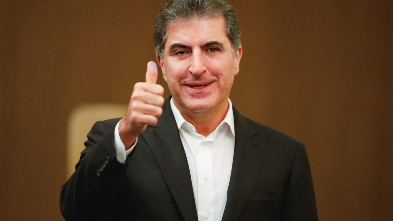 Kurdistan Region President Nechirvan Barzani gestures on the day he votes during the parliamentary election in Erbil, Iraq, November 11, 2025.