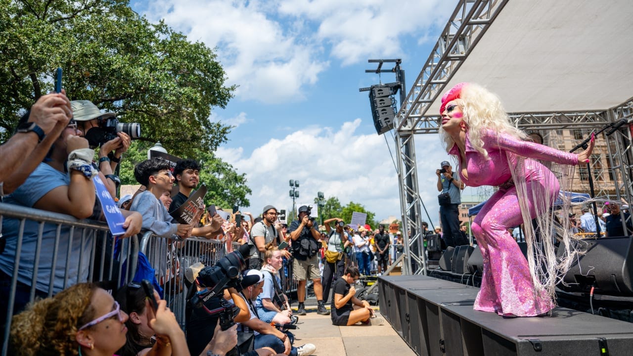 Drag Queen Brigitte Bandit performs during the "Stop the Trump takeover" demonstration outside of the State Capitol on August 16, 2025 in Austin, Texas.