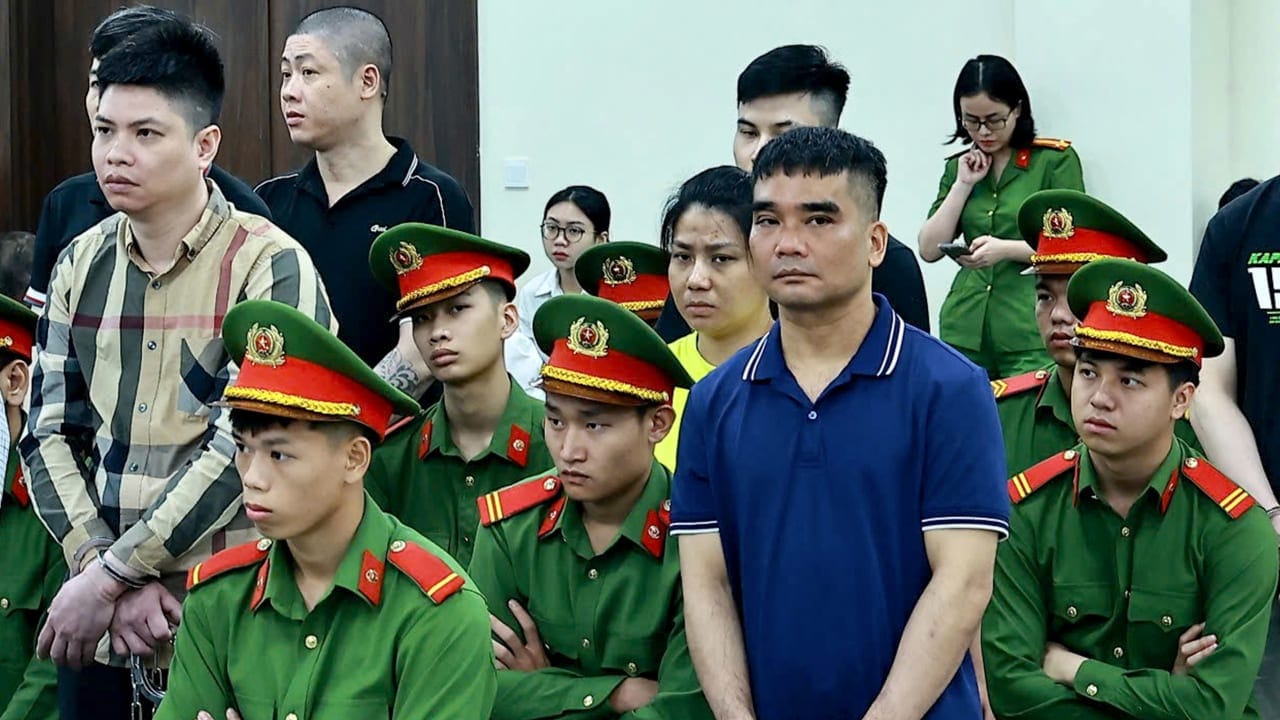 Former police officer Ha Minh Duc (L) and Nguyen Van Hung (2nd R) are seen during a hearing at the People's Court in Hanoi on July 1, 2025. A Vietnam court sentenced 11 people to death on July 2, including two police officers, after finding them guilty of trafficking drugs over the border from Laos.