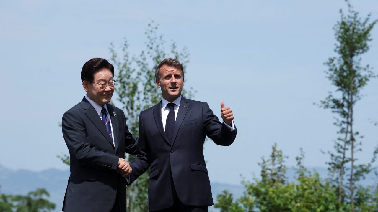 French President Emmanuel Macron welcomes South Korea's President Lee Jae Myung during the G7 summit, in Evian-les-Bains, France, June 16, 2026.