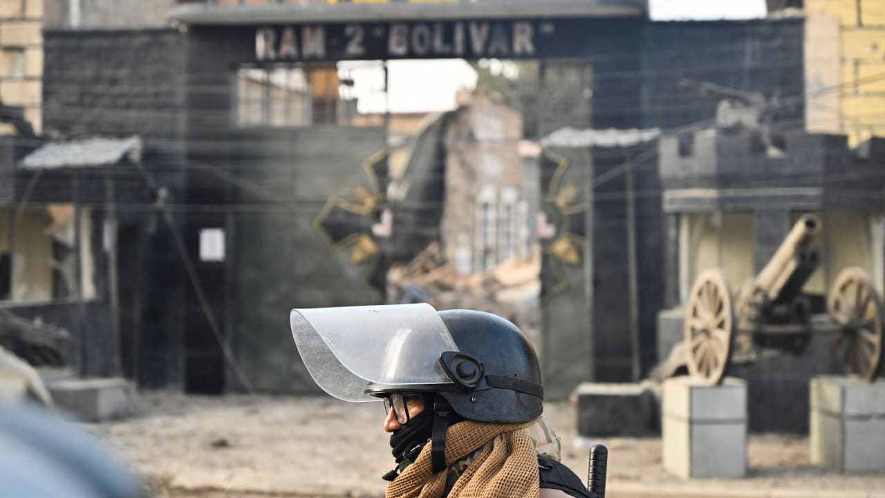 A military officer walks through the affected area a day after loud explosions that left people dead and injured at a military barracks, in Viacha, Bolivia, September 5, 2026.