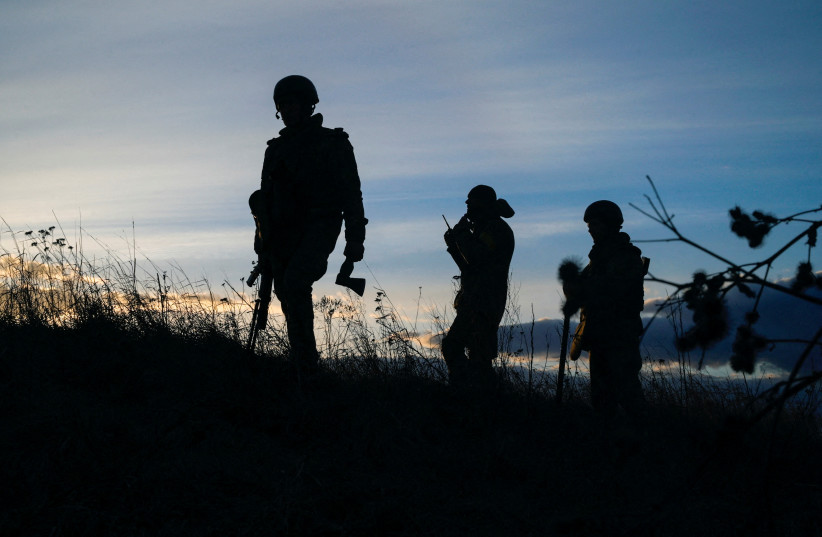  Ukrainian servicemen take positions at the military airbase Vasylkiv in the Kyiv region, Ukraine (photo credit: Maksim Levin/Reuters)