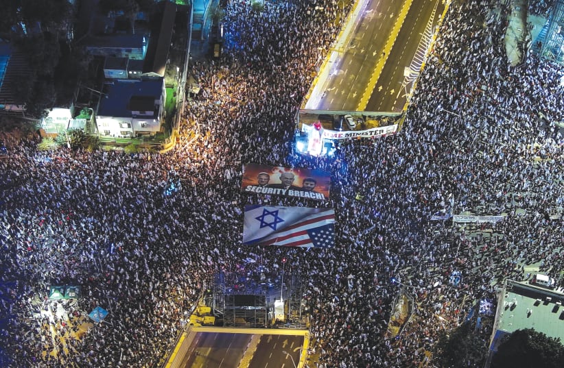  US JEWS see 300,000 Israelis – 2.5% of the population – protesting weekly, which would be the equivalent of eight million Americans protesting every week for more over than three months. (photo credit: ILAN ROSENBERG/REUTERS)