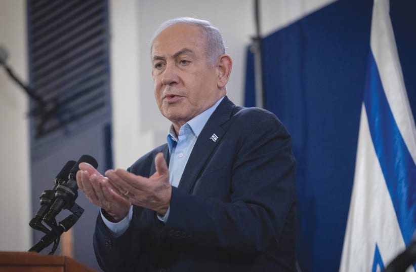  PRIME MINISTER Benjamin Netanyahu attends a news conference at the Defense Ministry in Tel Aviv.  (photo credit: Chaim Goldberg/Flash90)