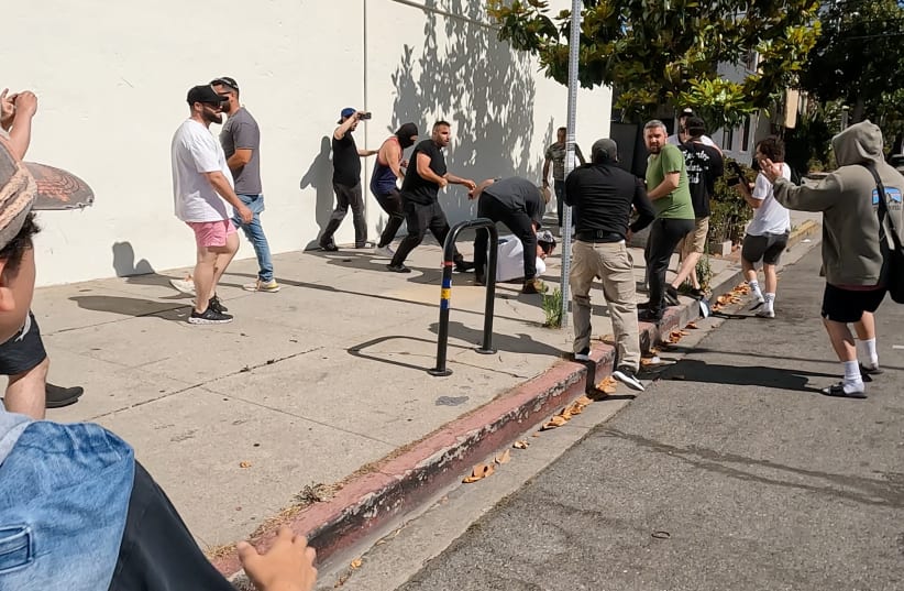  Pro-Palestinian protesters clash with counter-protesters, near Adas Torah synagogue in Pico-Robertson neighborhood, California, U.S., June 23, 2024, in this still image obtained from a video. (photo credit: REUTERS/SHAY HORSE)