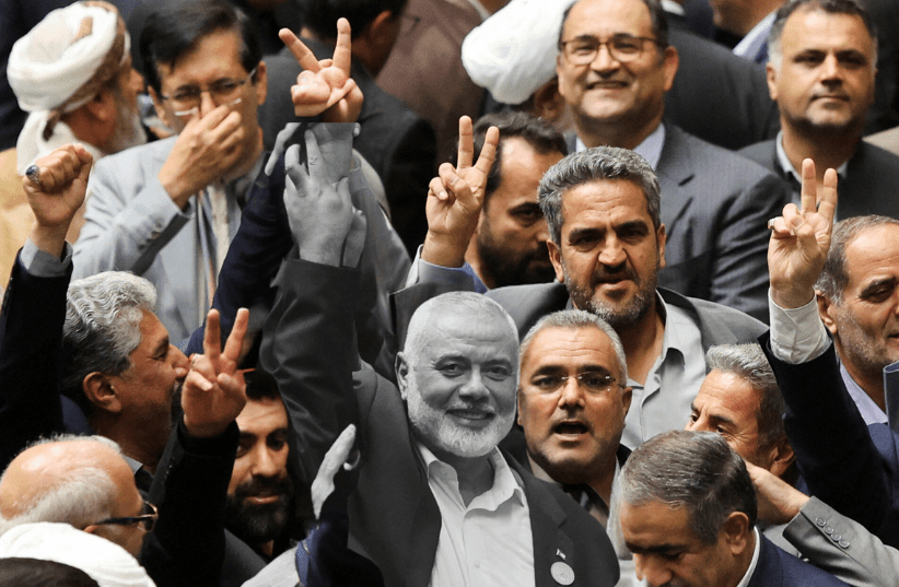  Palestinian group Hamas' top leader Ismail Haniyeh (grayed out) in Tehran, Iran (photo credit: MAJID ASGARIPOUR/WANA (WEST ASIA NEWS AGENCY) VIA REUTERS)