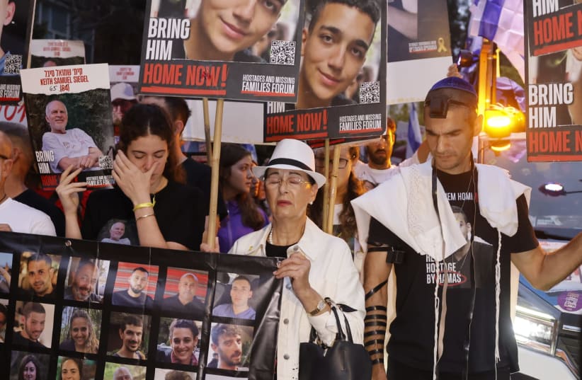  Shir Siegal, Levi and Varda Ben Baruch, whose family members are being held hostage by Hamas, gather outside the prime minister's residence on October 7, 2024 (photo credit: MARC ISRAEL SELLEM)