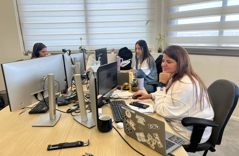 Women working at the Samana office, December 17, 2024. (photo credit: FELICE FRIEDSON/THE MEDIA LINE)