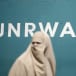 A Palestinian woman takes part in a protest against possible reductions of the services and aid offered by United Nations Relief and Works Agency (UNRWA), in front of UNRWA headquarters in Gaza City August 16, 2015.