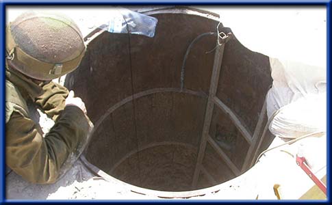 Another Hamas Ceasefire Cemented in Future War Engineering Corp soldier looking down a Palestinian-dug tunnel.