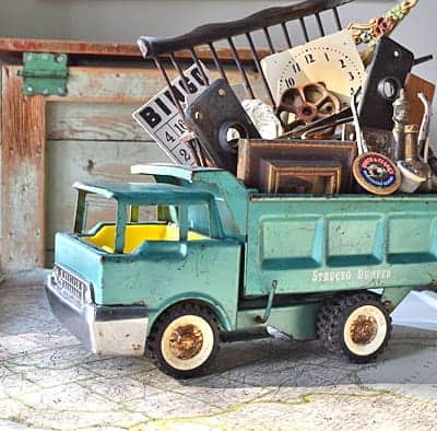 Vintage toy truck with antiques and junk.