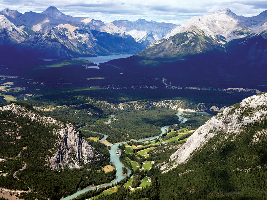The Bow River (centre foreground) in Banff National Park, Alberta, Canada. In the centre background is Lake Louise.