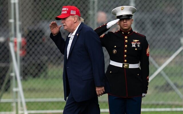 US President Donald Trump returns a salute as he walks from Marine One to his limousine upon his arrival at the Ellipse just outside of the White House, August 16, 2026, in Washington. (AP/Jose Luis Magana) US President Donald Trump returns a salute as he walks from Marine One to his limousine upon his arrival at the Ellipse just outside of the White House, August 16, 2026, in Washington. (AP/Jose Luis Magana)