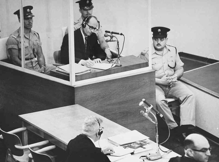 Adolf Eichmann takes notes during his trial in Jerusalem. (GPO) Adolf Eichmann takes notes during his trial in Jerusalem. (GPO)