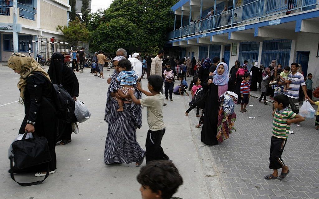Palestinians at an UNRWA school after fleeing their homes following an Israeli ground offensive in Rafah in the southern Gaza Strip, on July 18, 2014. (photo credit: Abed Rahim Khatib/Flash90) Palestinians at an UNRWA school after fleeing their homes following an Israeli ground offensive in Rafah in the southern Gaza Strip, on July 18, 2014. (photo credit: Abed Rahim Khatib/Flash90)