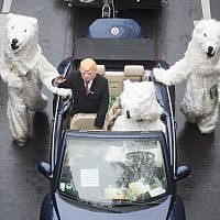 Demonstrators costumed as US President Donald Trump and polar bears protest against the climate change during climate conference COP in Bonn, western Germany, Saturday, Nov. 11, 2017. (Bernd Thissen/dpa via AP)