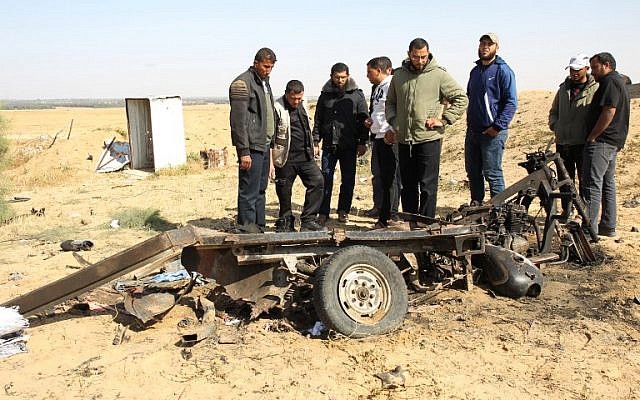 Illustrative: Palestinian men look at the debris of a tuk tuk vehicle at the site of an explosion east of Rafah in the southern Gaza Strip, on April 14, 2018. Four members of Islamic Jihad died in the blast (AFP PHOTO / SAID KHATIB) Illustrative: Palestinian men look at the debris of a tuk tuk vehicle at the site of an explosion east of Rafah in the southern Gaza Strip, on April 14, 2018. Four members of Islamic Jihad died in the blast (AFP PHOTO / SAID KHATIB)