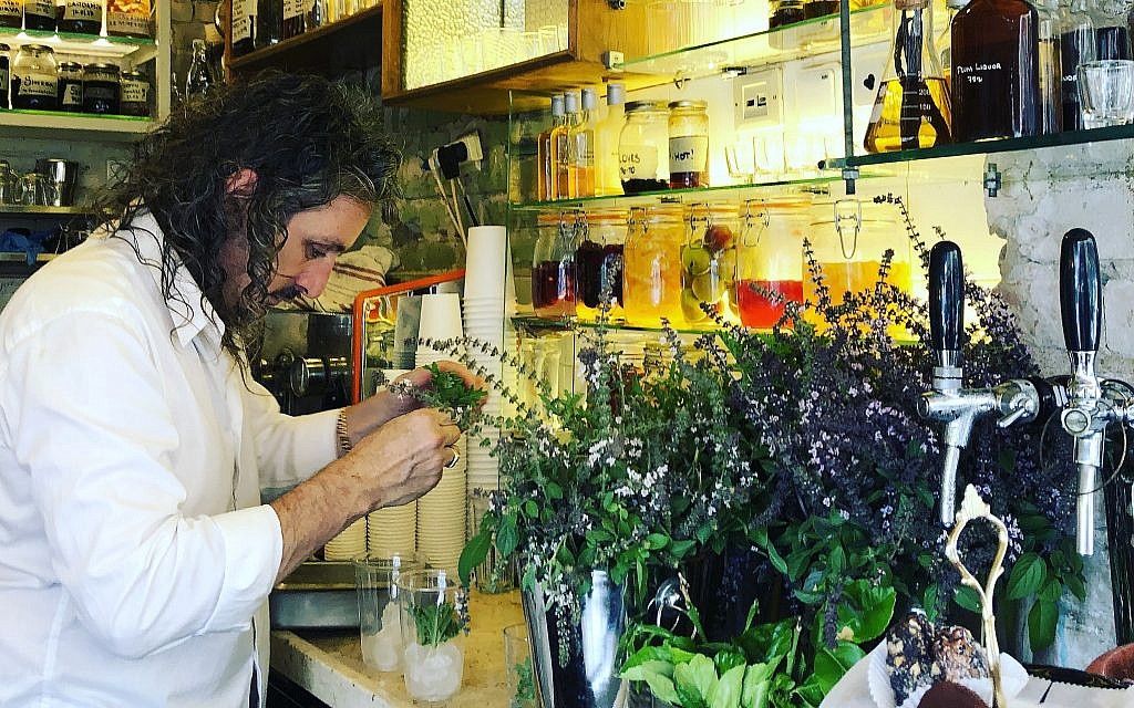 Benny Briga concocts another carbonated elixir at Cafe Levinsky in the Levinsky Market, this one with tahini, for a slightly sweet, milky and satisfying drink (Jessica Steinberg/Times of Israel) Benny Briga concocts another carbonated elixir at Cafe Levinsky in the Levinsky Market, this one with tahini, for a slightly sweet, milky and satisfying drink (Jessica Steinberg/Times of Israel)