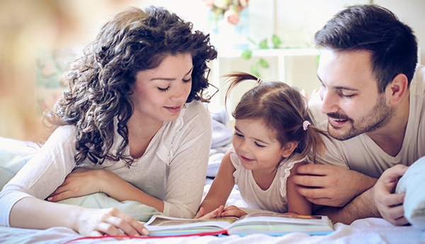 Family reading a book