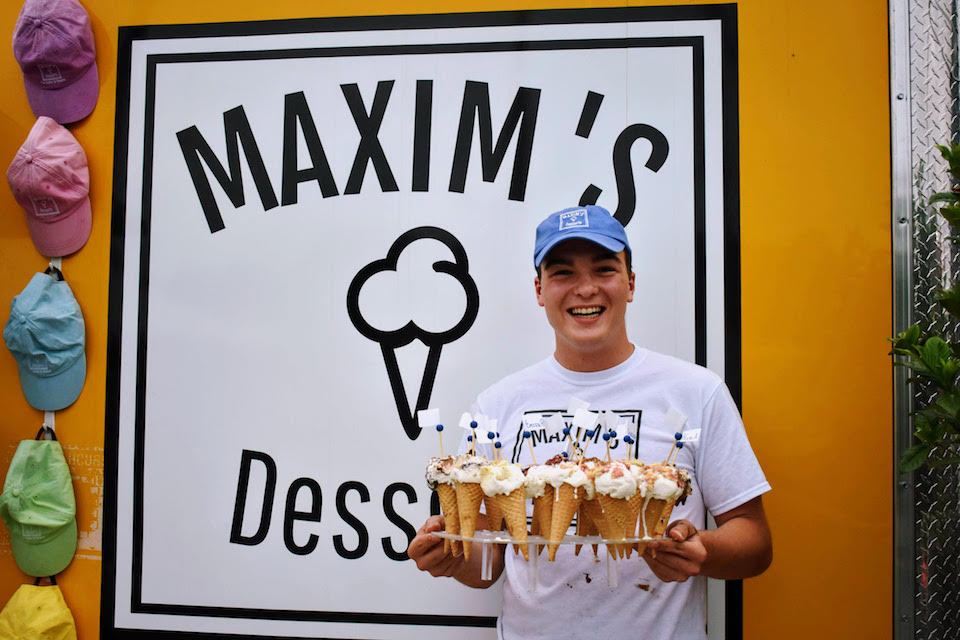 max leblanc holds a tray of pie cones