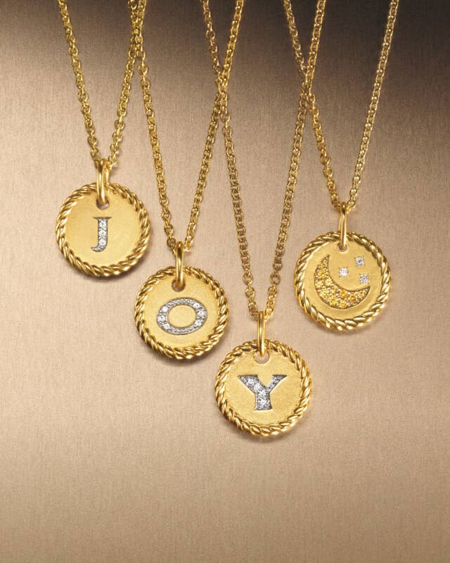 David Yurman initial charms in gold.