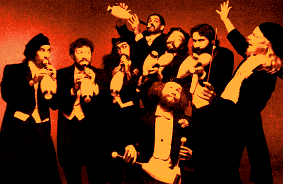 THE KLEZMORIM with The Flying Karamazov Brothers, San Francisco, 1983. L to R: Tim Furst, Lev Liberman, Paul Magid, Brian Wishnefsky, Howard Patterson, Sam Williams, Kevin Linscott, Randy Nelson. Not pictured: Donald Thornton, David Julian Gray, Tom Stamper. [Photo: Paul Schraub]